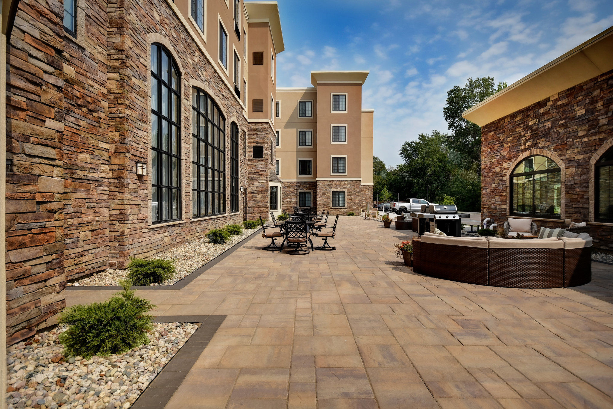 image Discover the outdoor courtyard with seating and a fire feature for relaxing evenings.