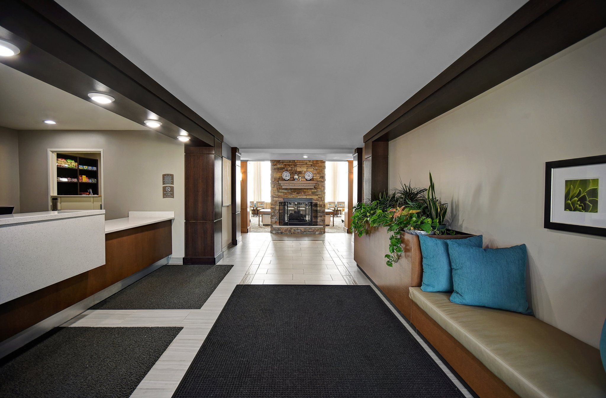 image Enjoy a welcoming lobby and breakfast area with fireplace and comfortable seating.