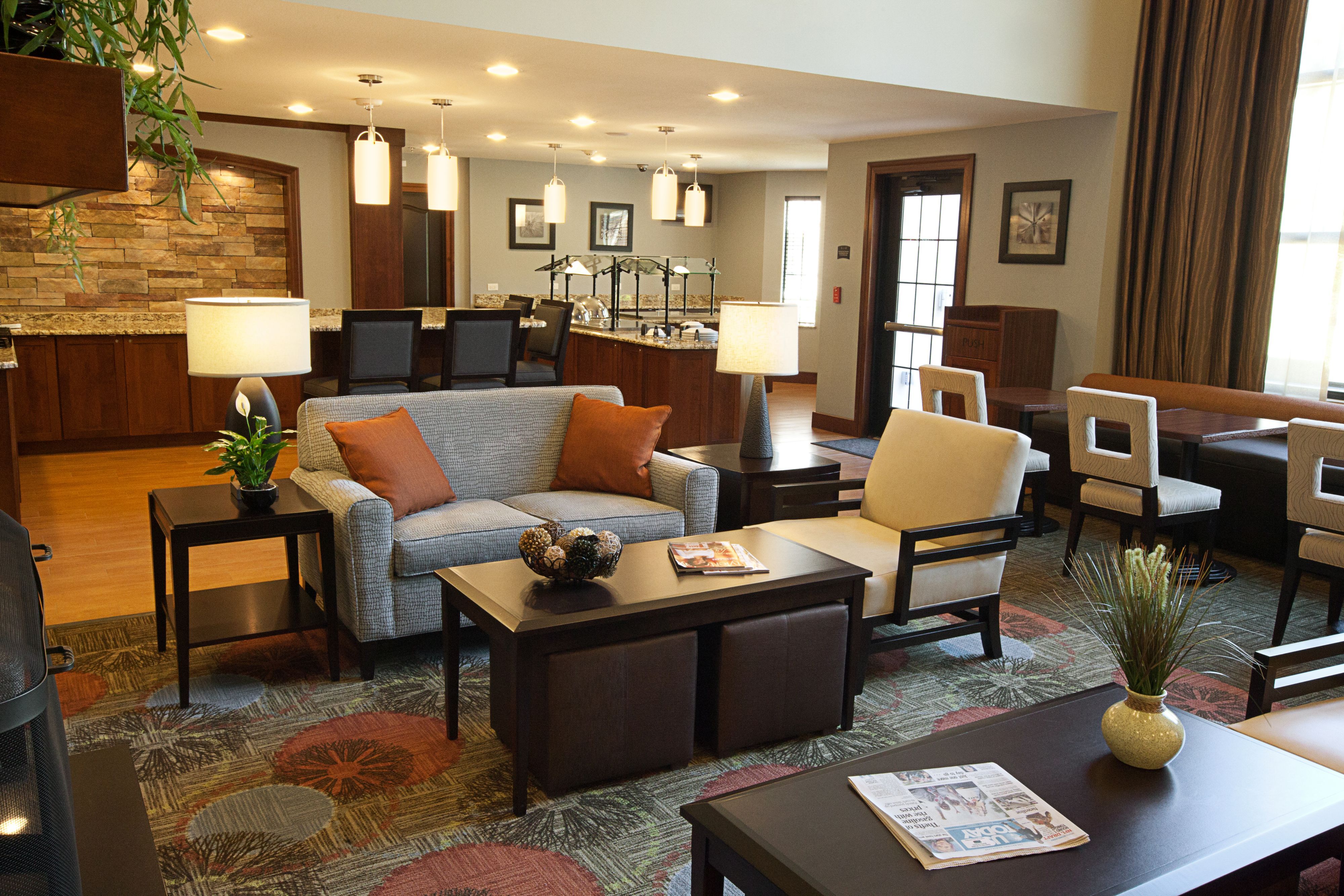 image Bright dining area with self-serve buffet stations and comfortable seating throughout.