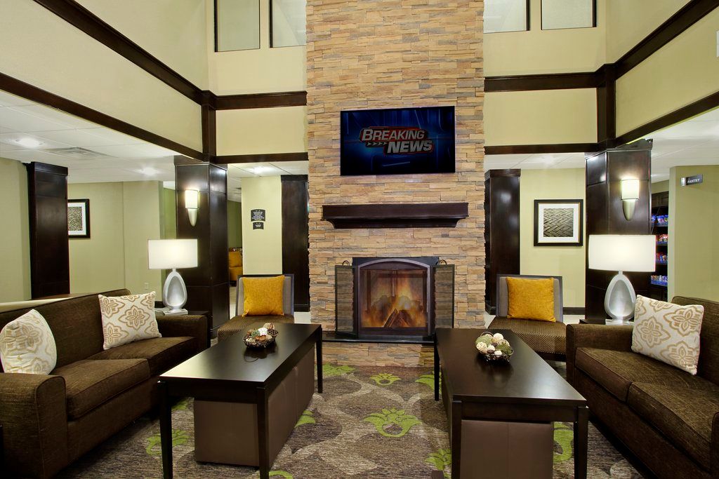 image Gather around the cozy fireplace while catching up on your favorite shows in a warm, inviting lounge.