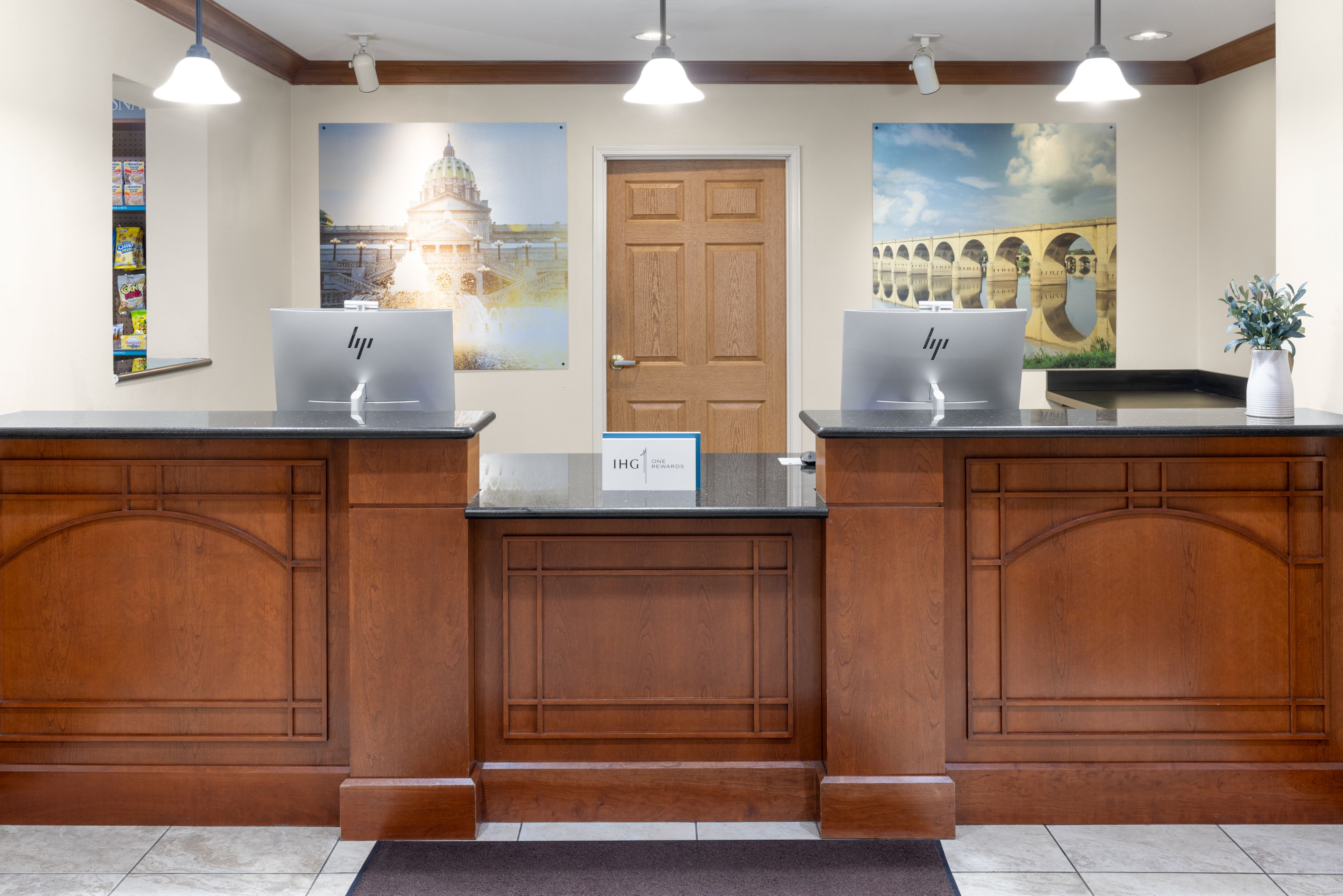 image Modern reception area with elegant wooden counters and vibrant artwork.