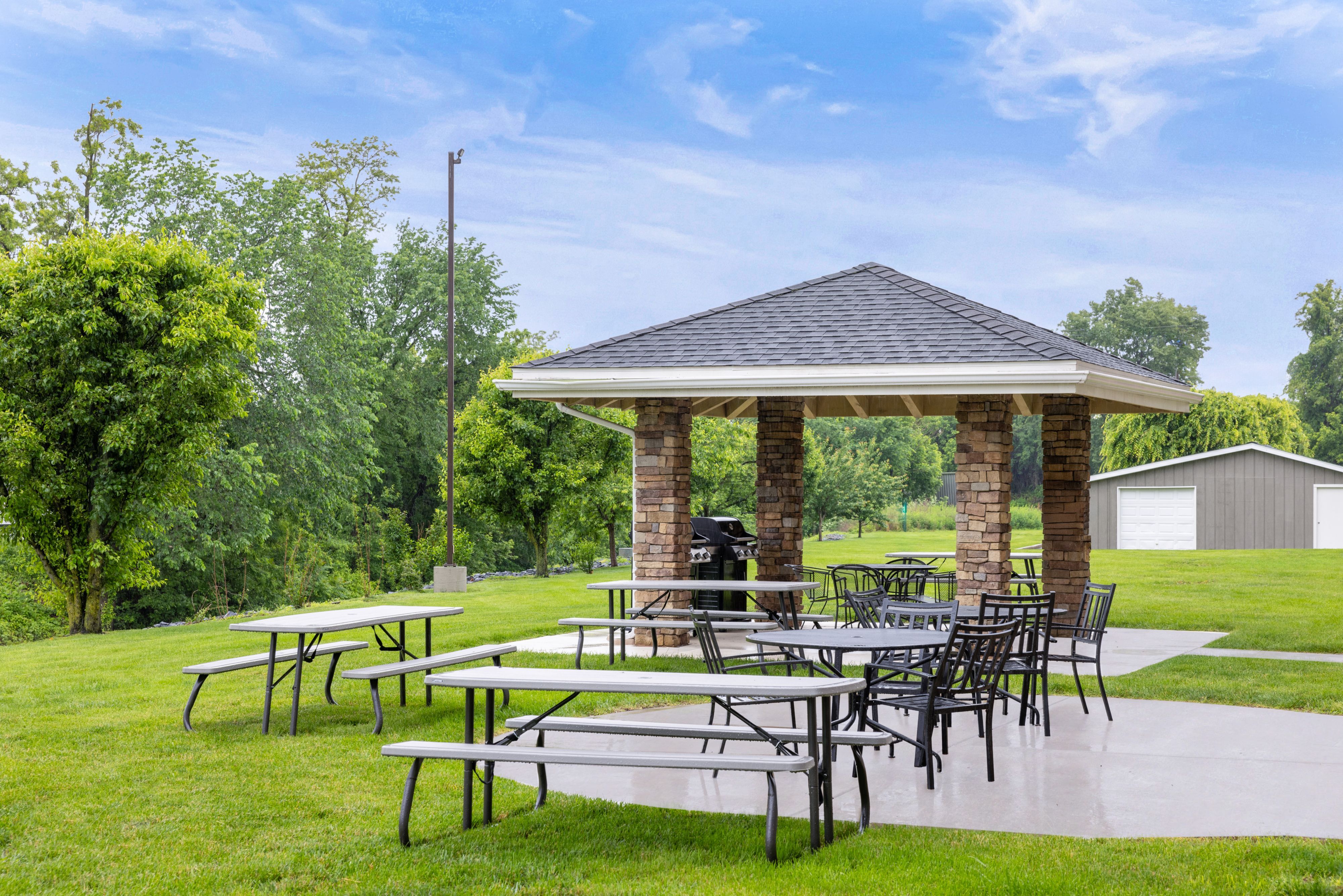 image Relaxing outdoor patio area with seating for alfresco dining.