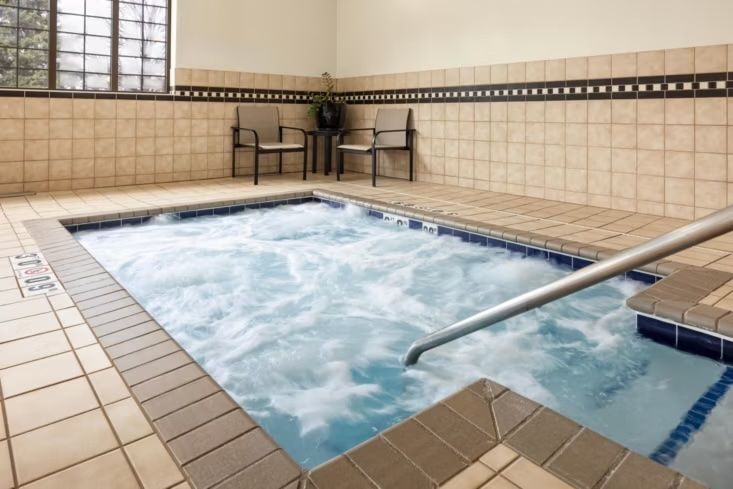 image Soak in the indoor hot tub, just off the pool area