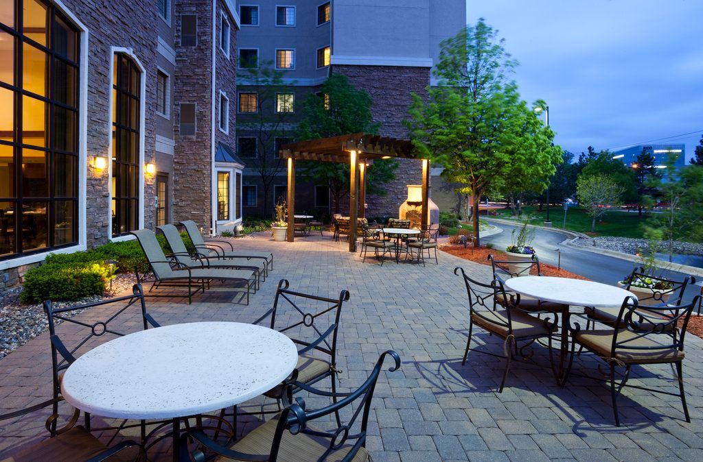image Gather around the fire pit on the outdoor patio as the sun goes down