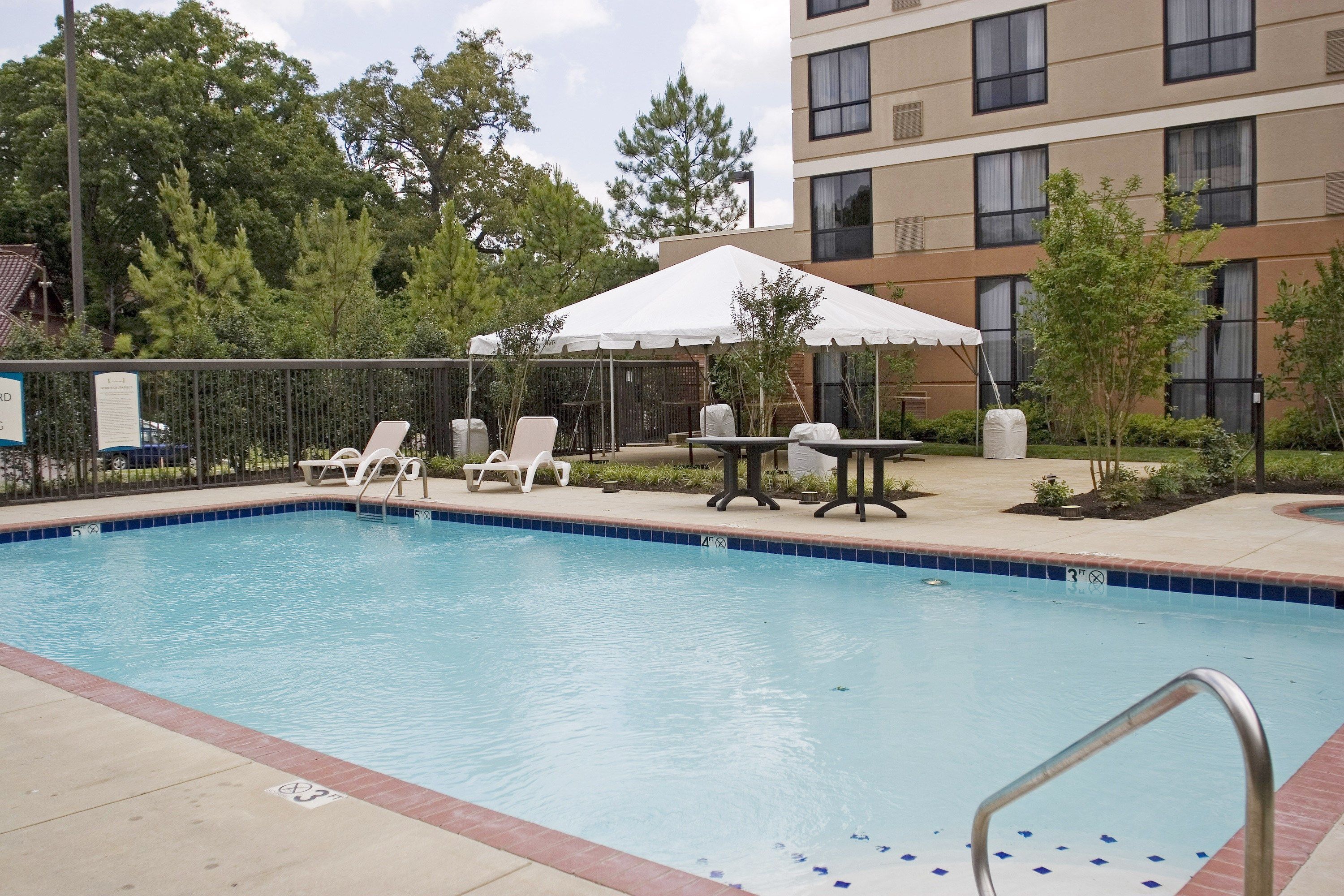 image Lounge around the pool after a day of adventure.