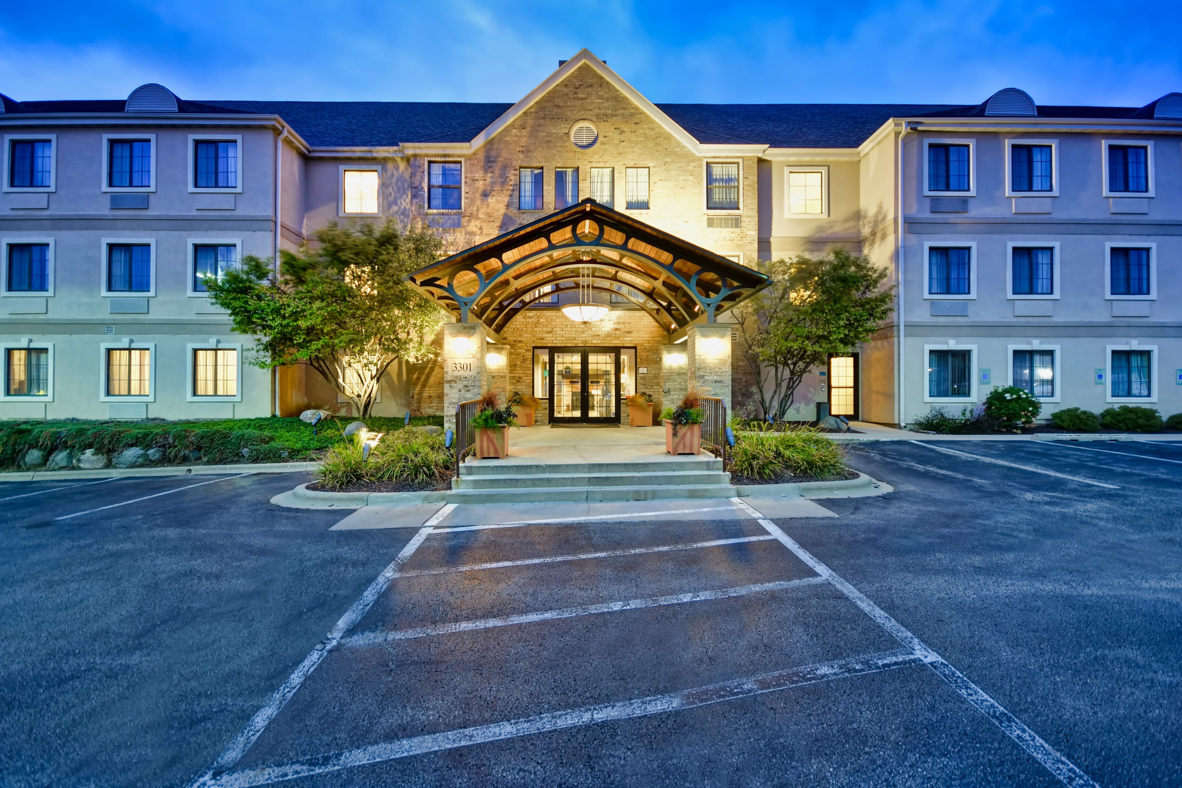 image Covered entrance with branded awning welcomes guests to the property