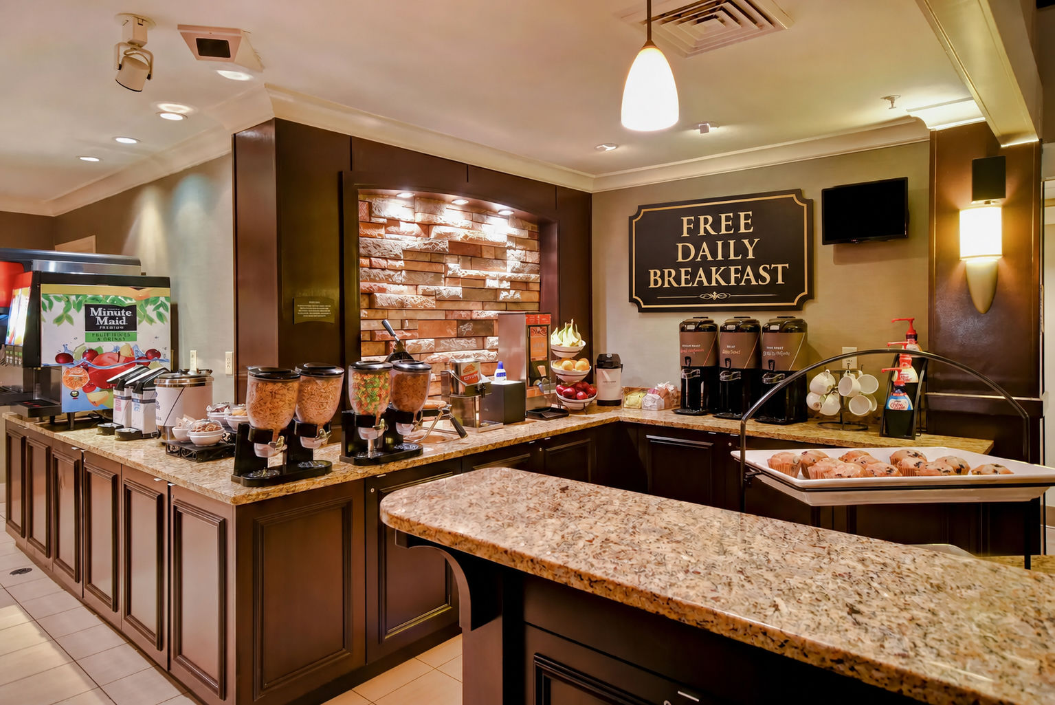 image Breakfast area with cereals, pastries, and beverages