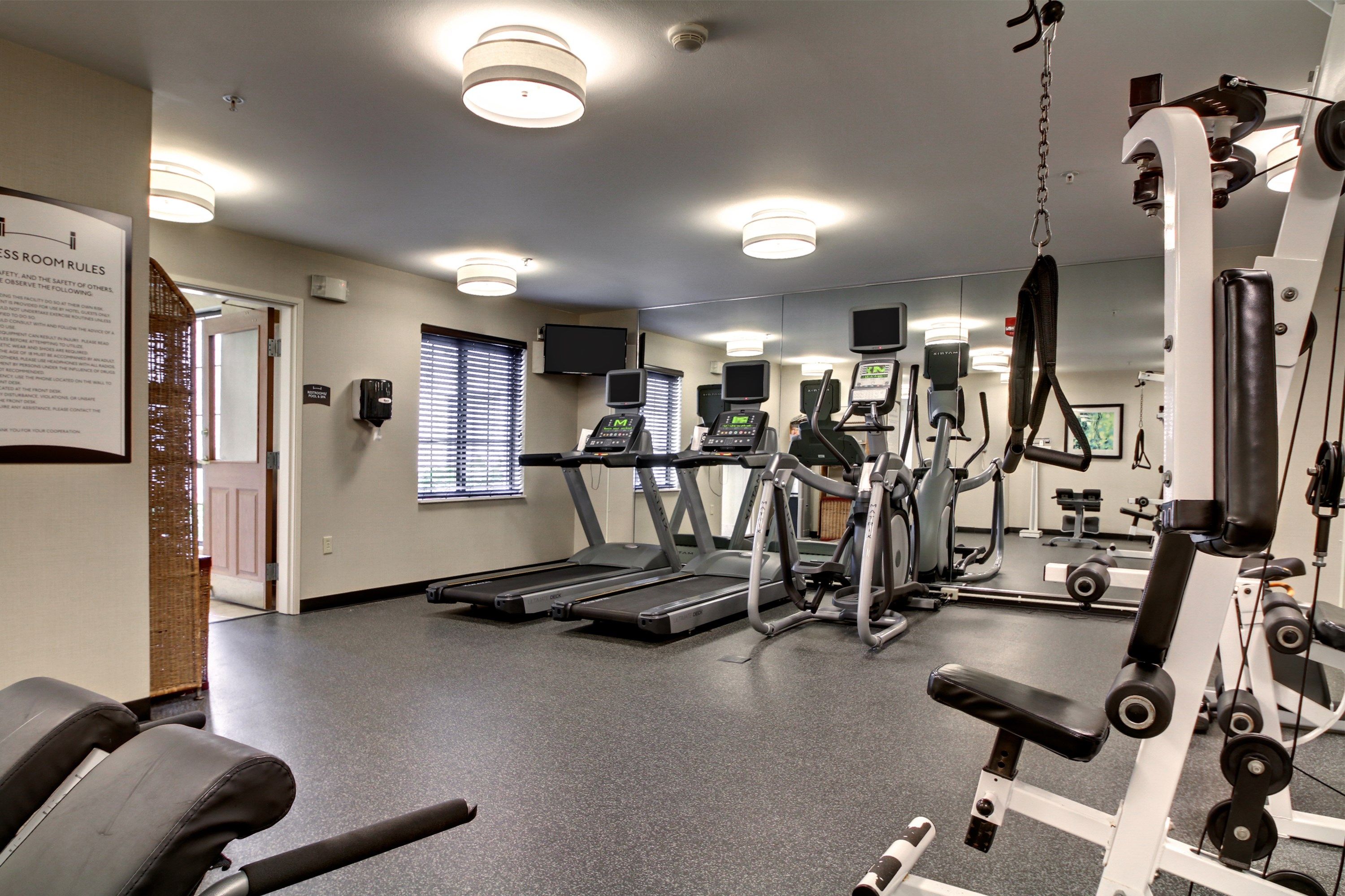 image Fitness center with cardio and weight equipment