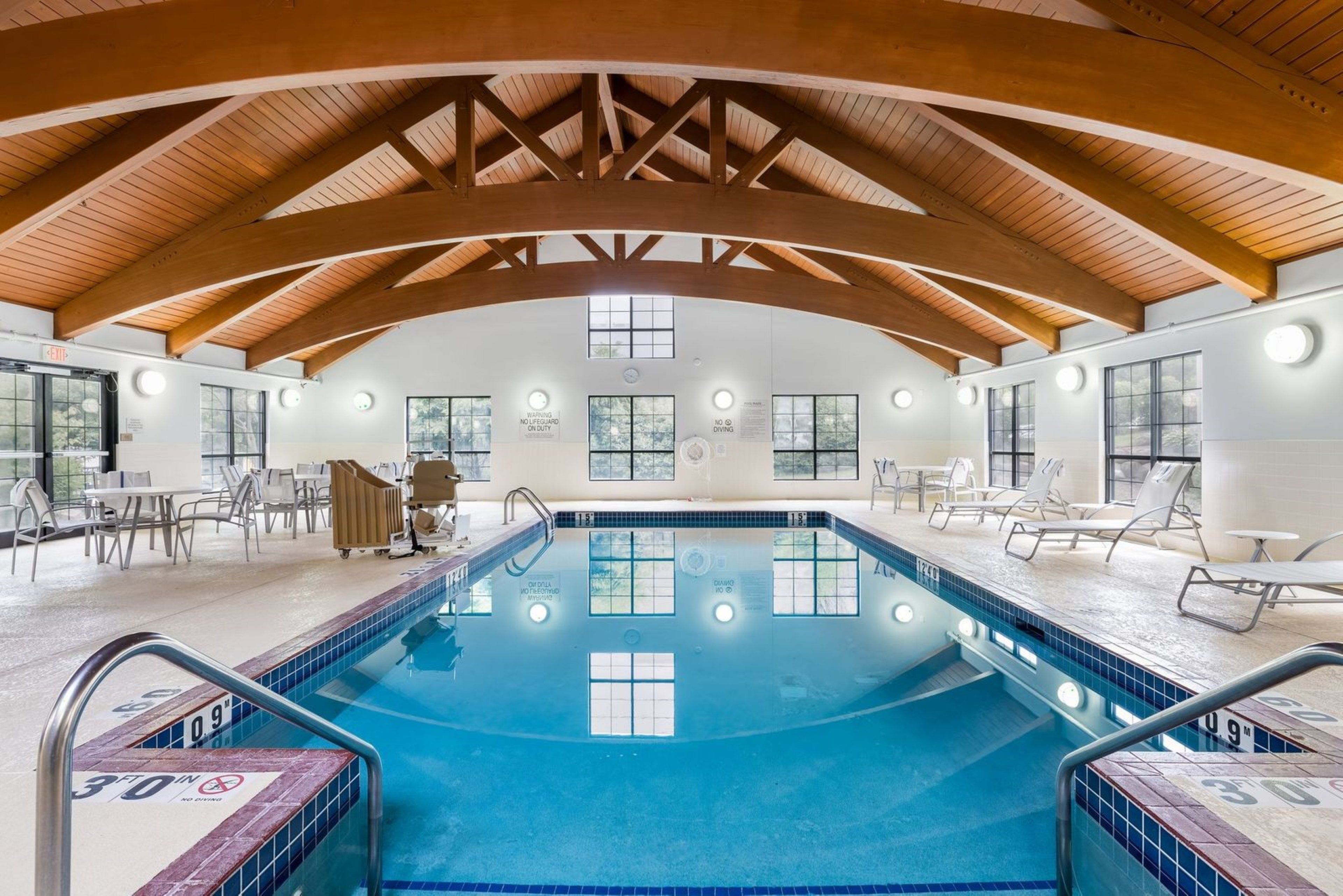 image Heated indoor pool with lounge chairs — open year-round for guests to enjoy