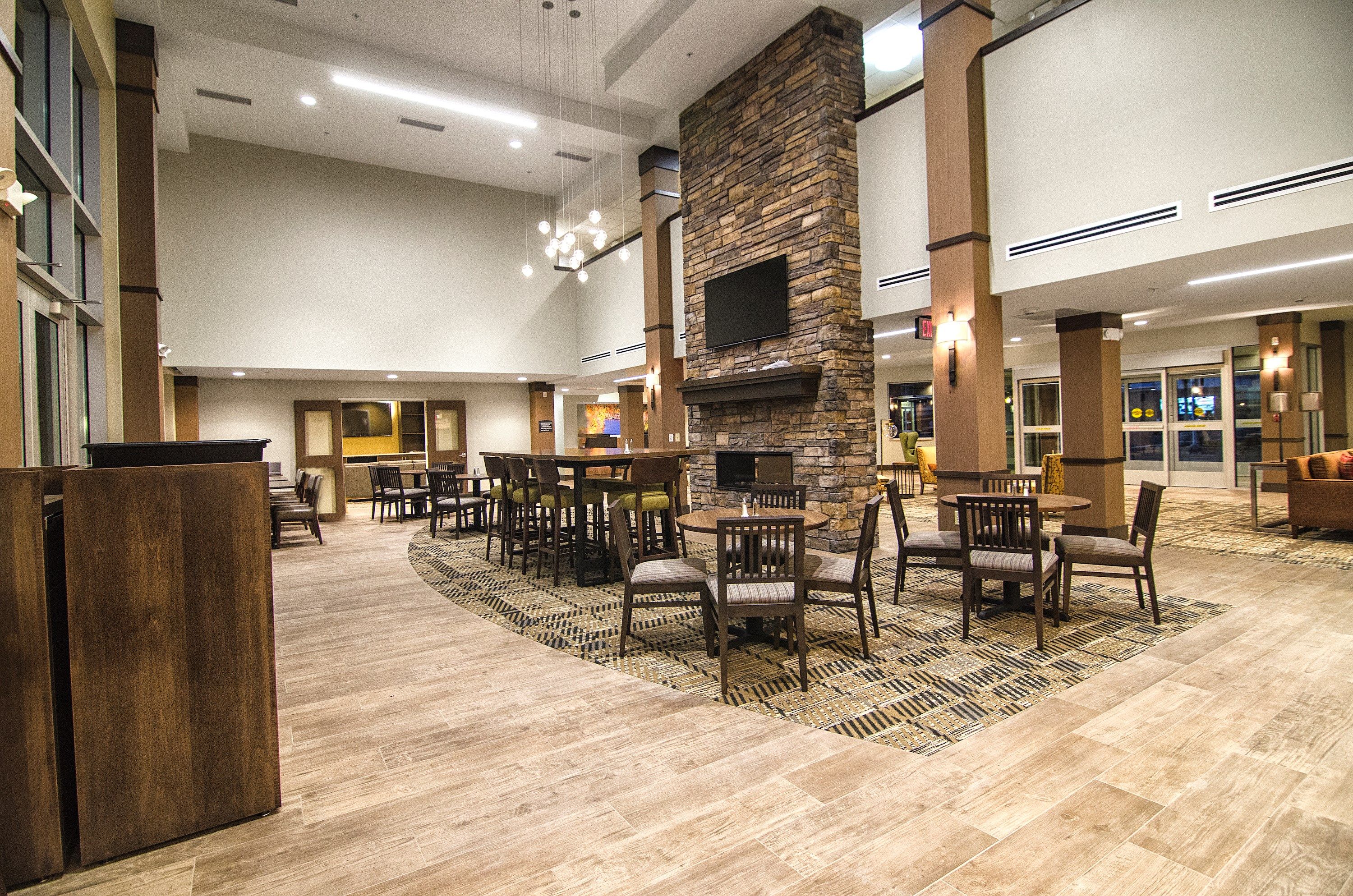 image Welcoming lobby lounge featuring a stone fireplace and plush seating.