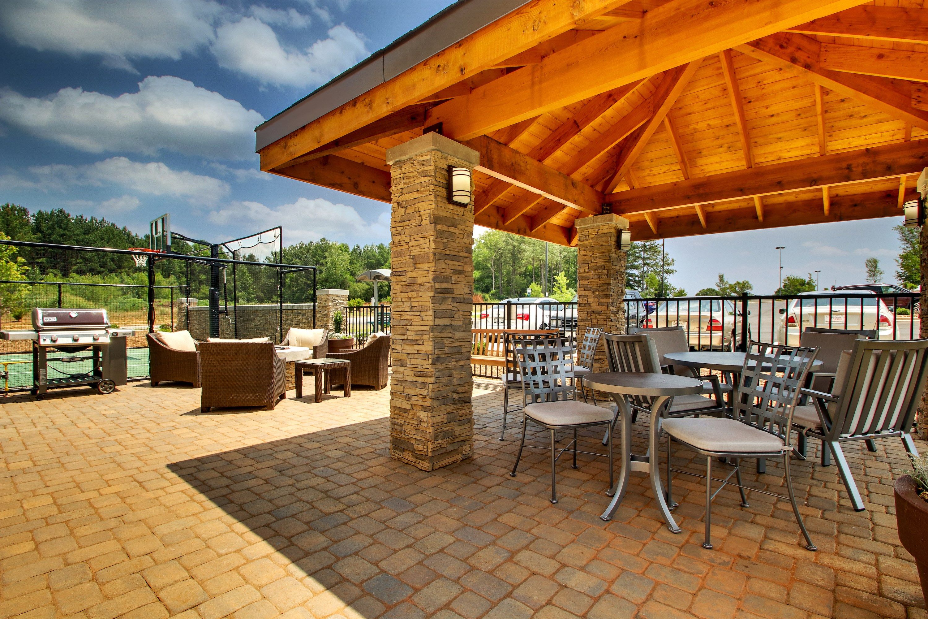 image Relax outside on the shared patios and cook a meal on the shared BBQs.