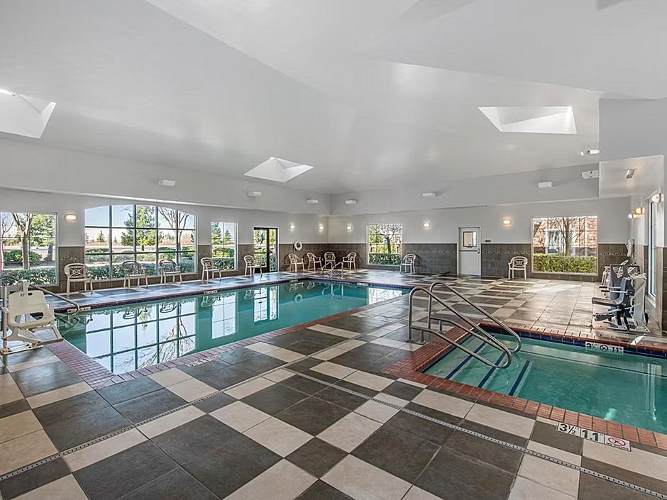 image Take a refreshing dip in the inviting indoor pool, surrounded by natural light.
