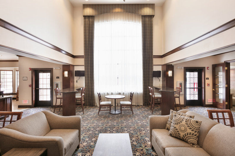 image Bright common area with tables and chairs — good for morning coffee or catching up with travel companions