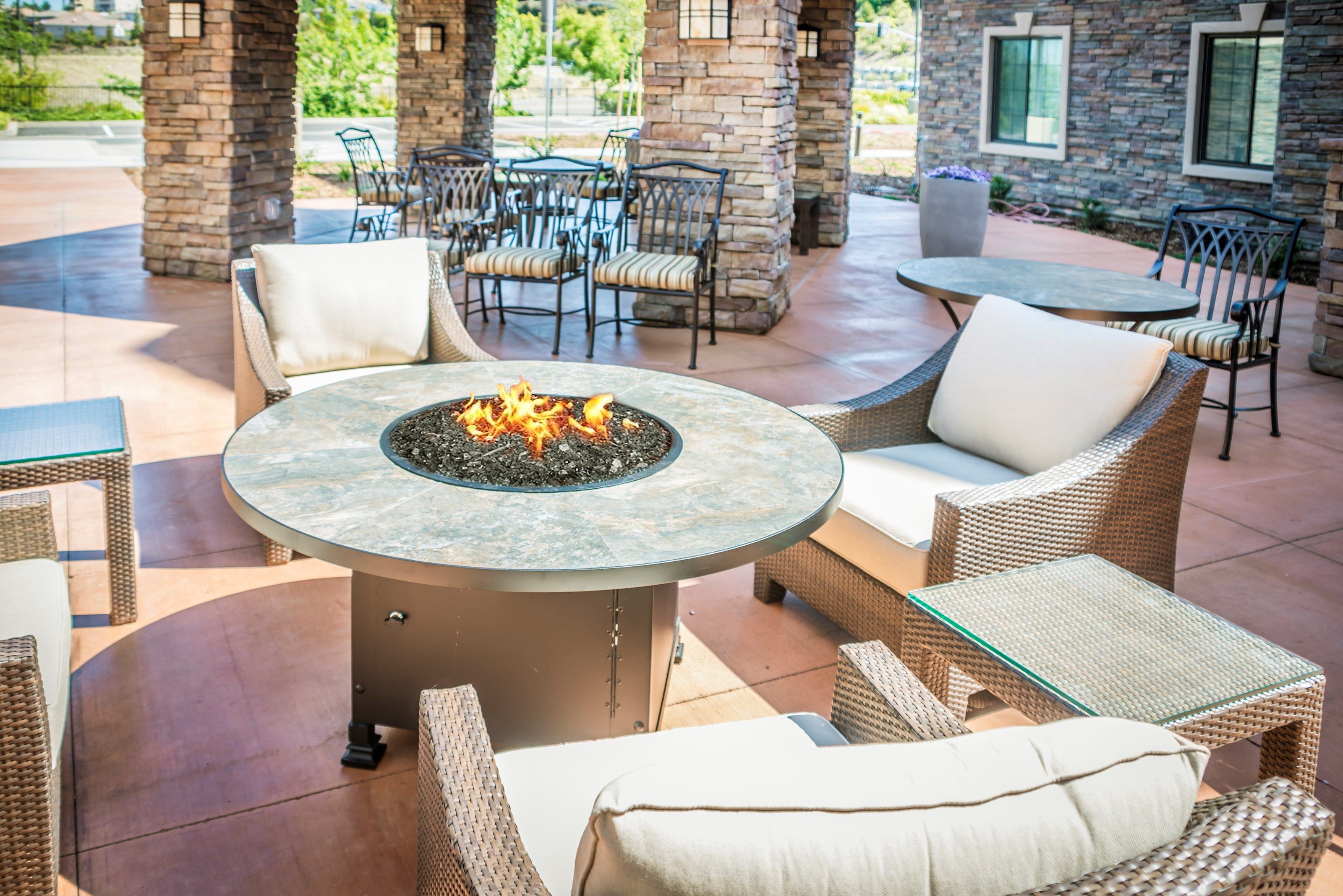 image Share laughs around the outdoor fire pit with your group.