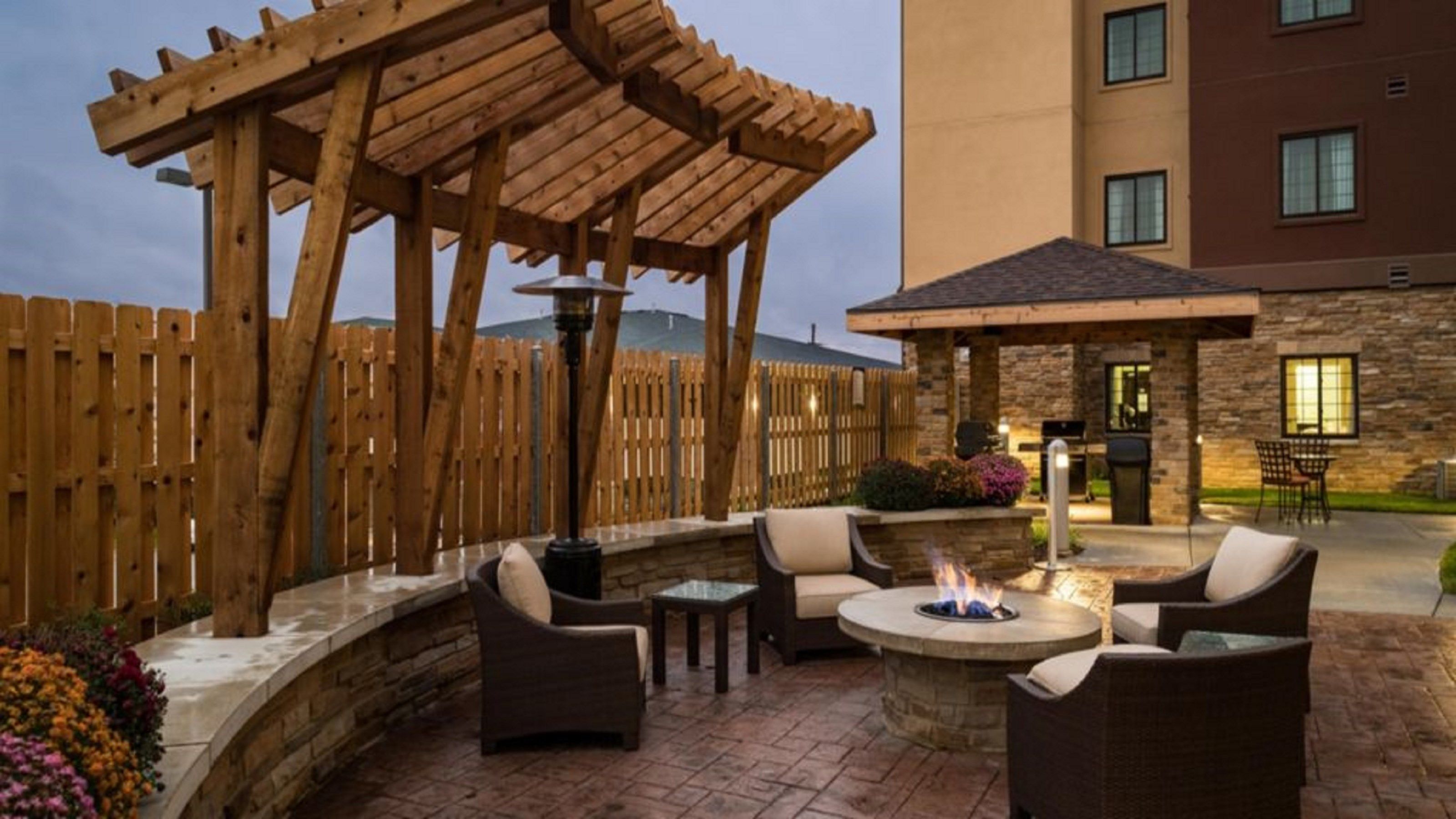 image Share laughs around the outdoor fire pit with your group.