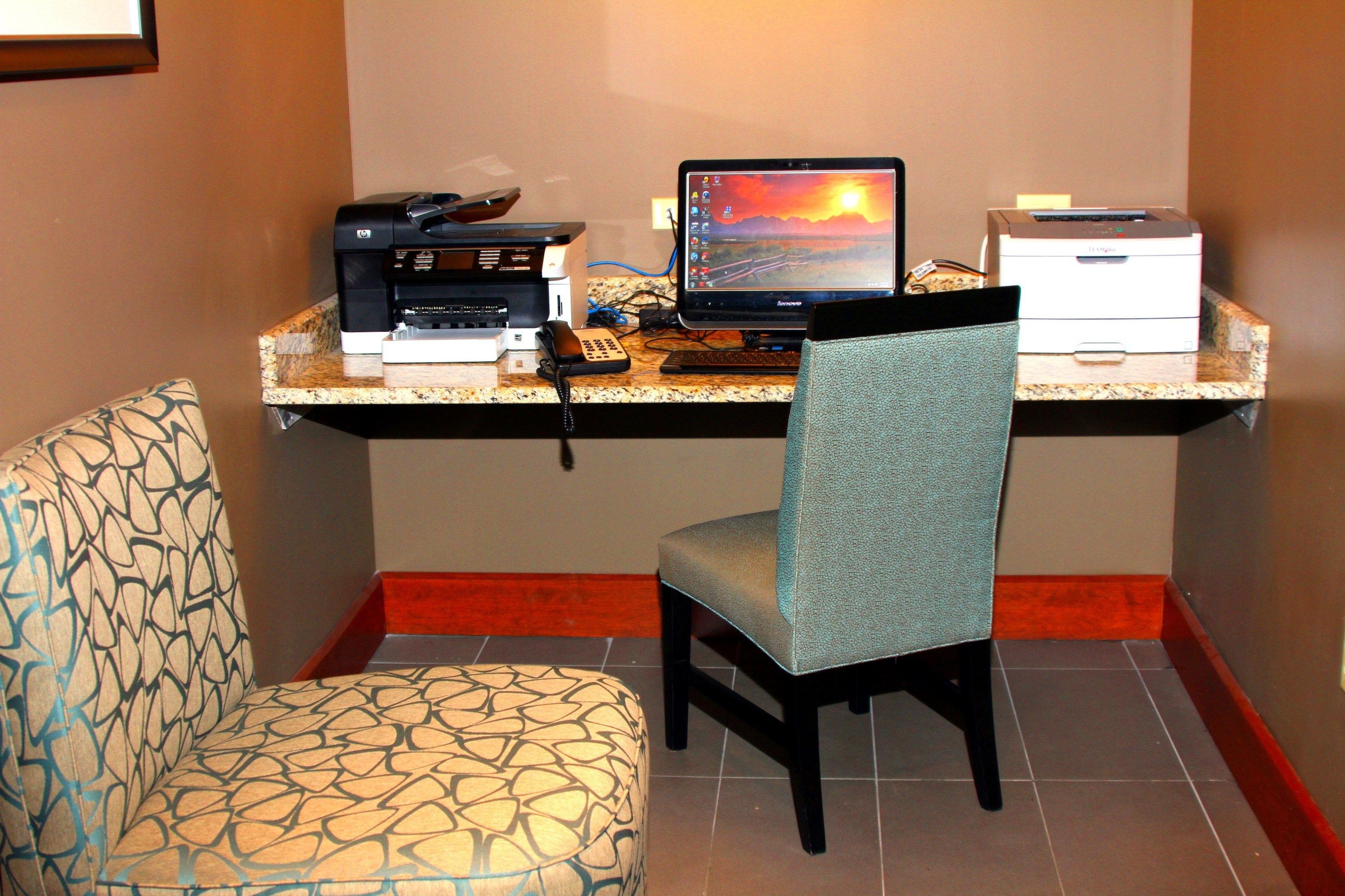 image Business center with computer workstations and printer.