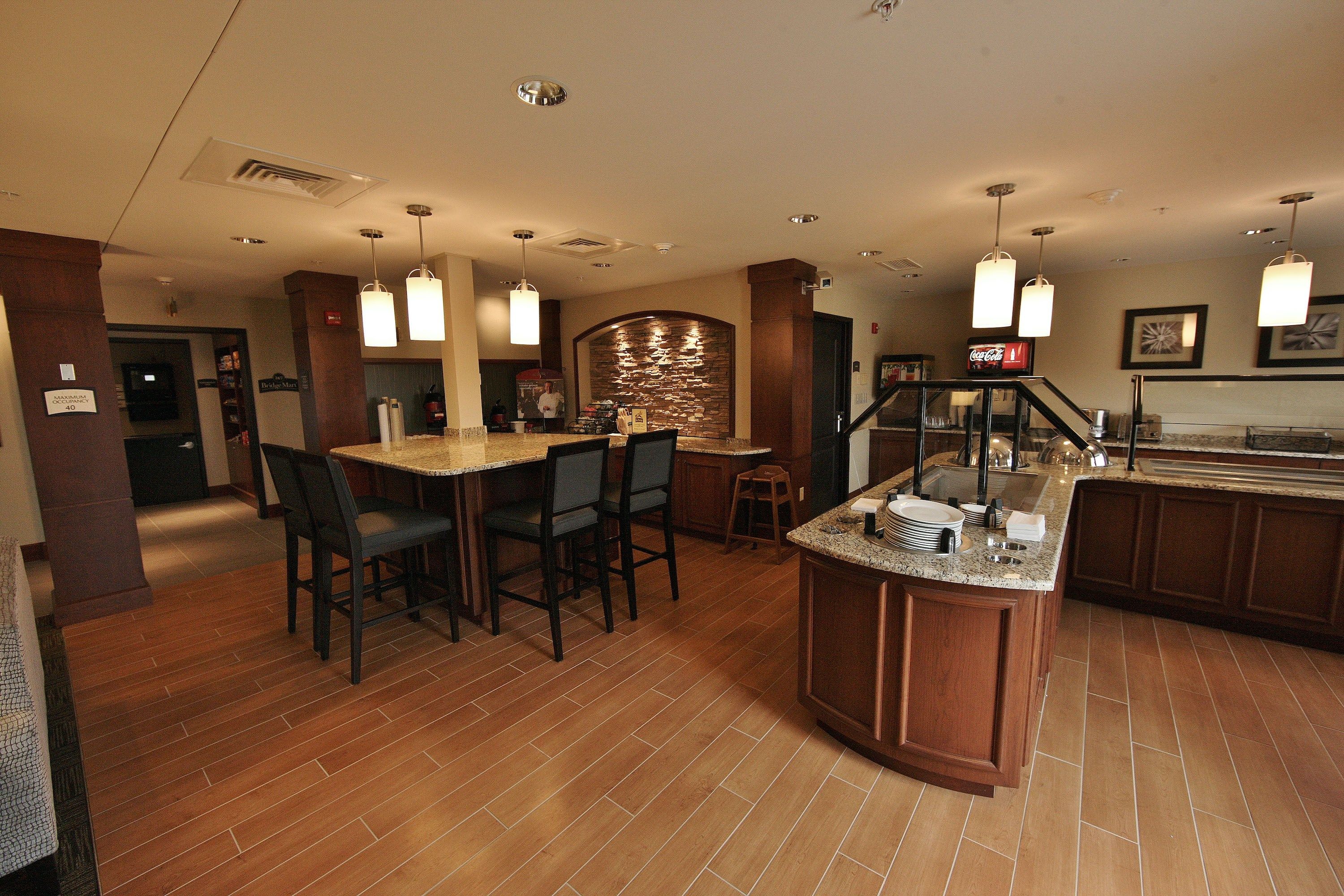 image Breakfast dining area with buffet counter and seating.
