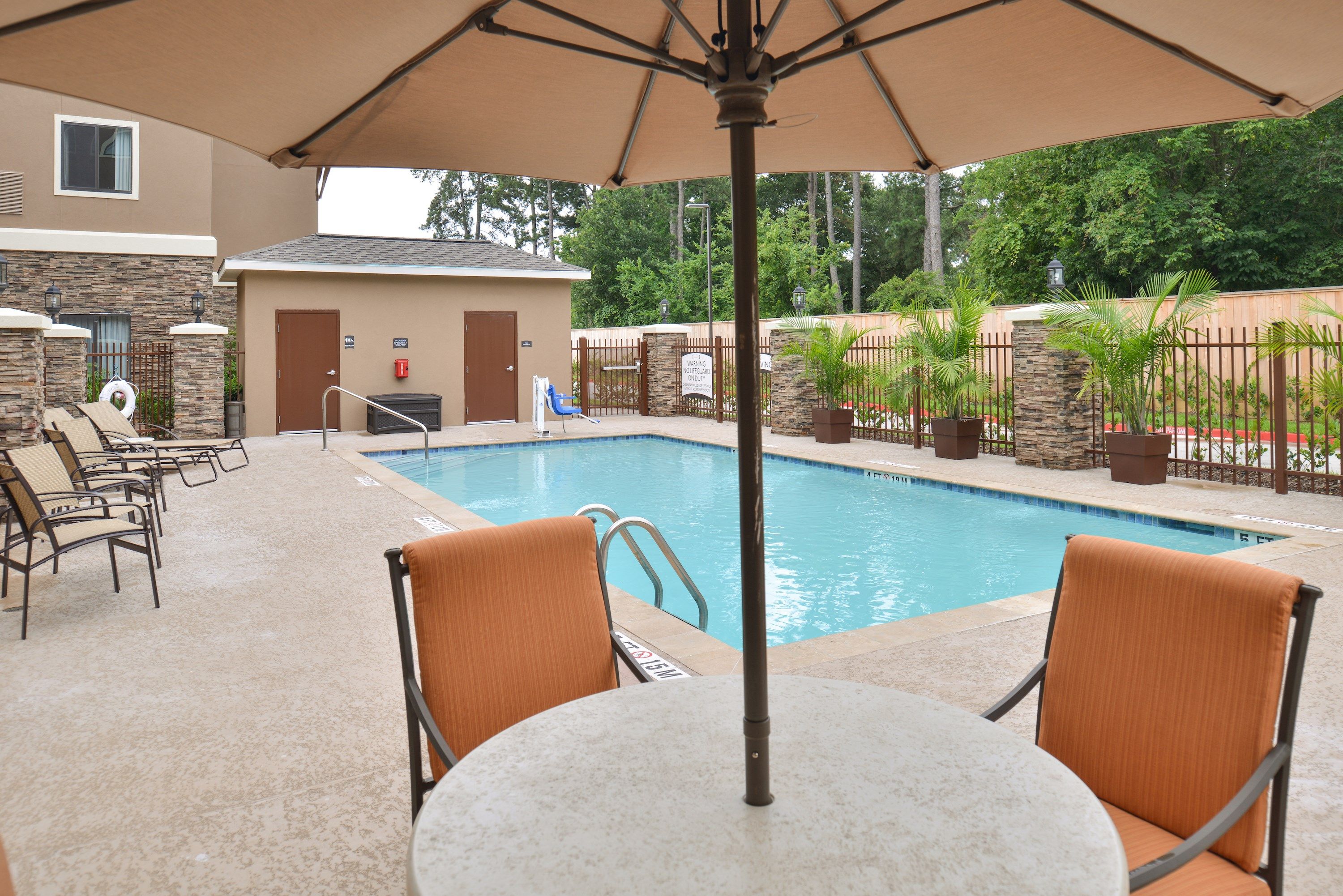 image Relax by the shared outdoor pool.