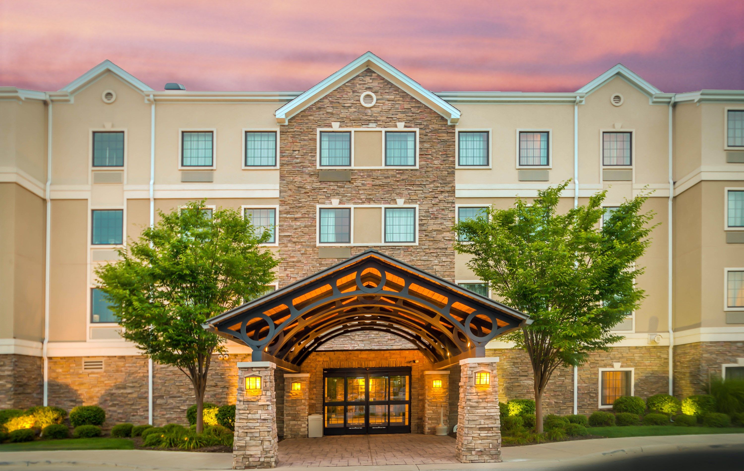 image Hotel exterior at dusk — the building is steps from The Shops at Fallen Timbers