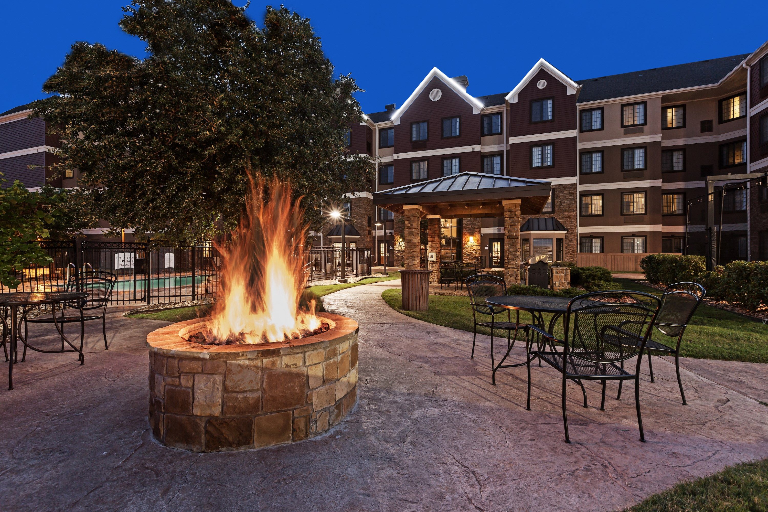 image Outdoor fire pit area with seating at night