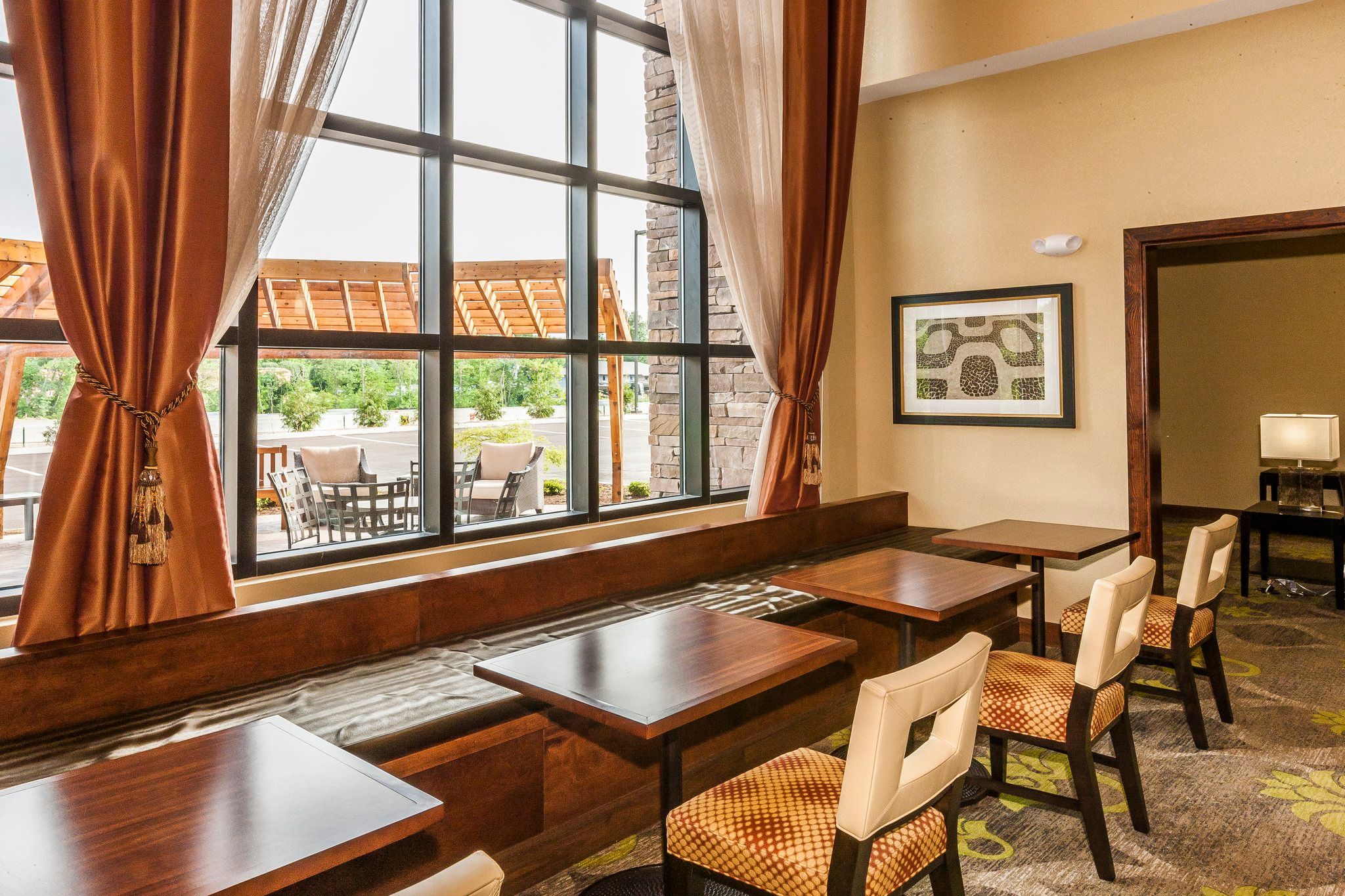 image Window seating with views of the outdoor patio — afternoon light makes this a good place to read or work