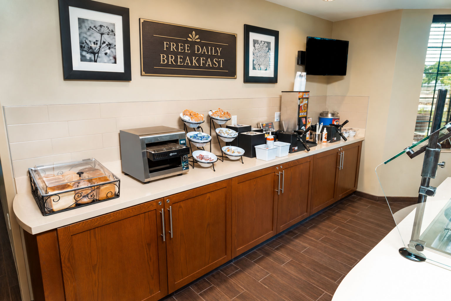image Breakfast area featuring various food items, a toaster, and a coffee machine.