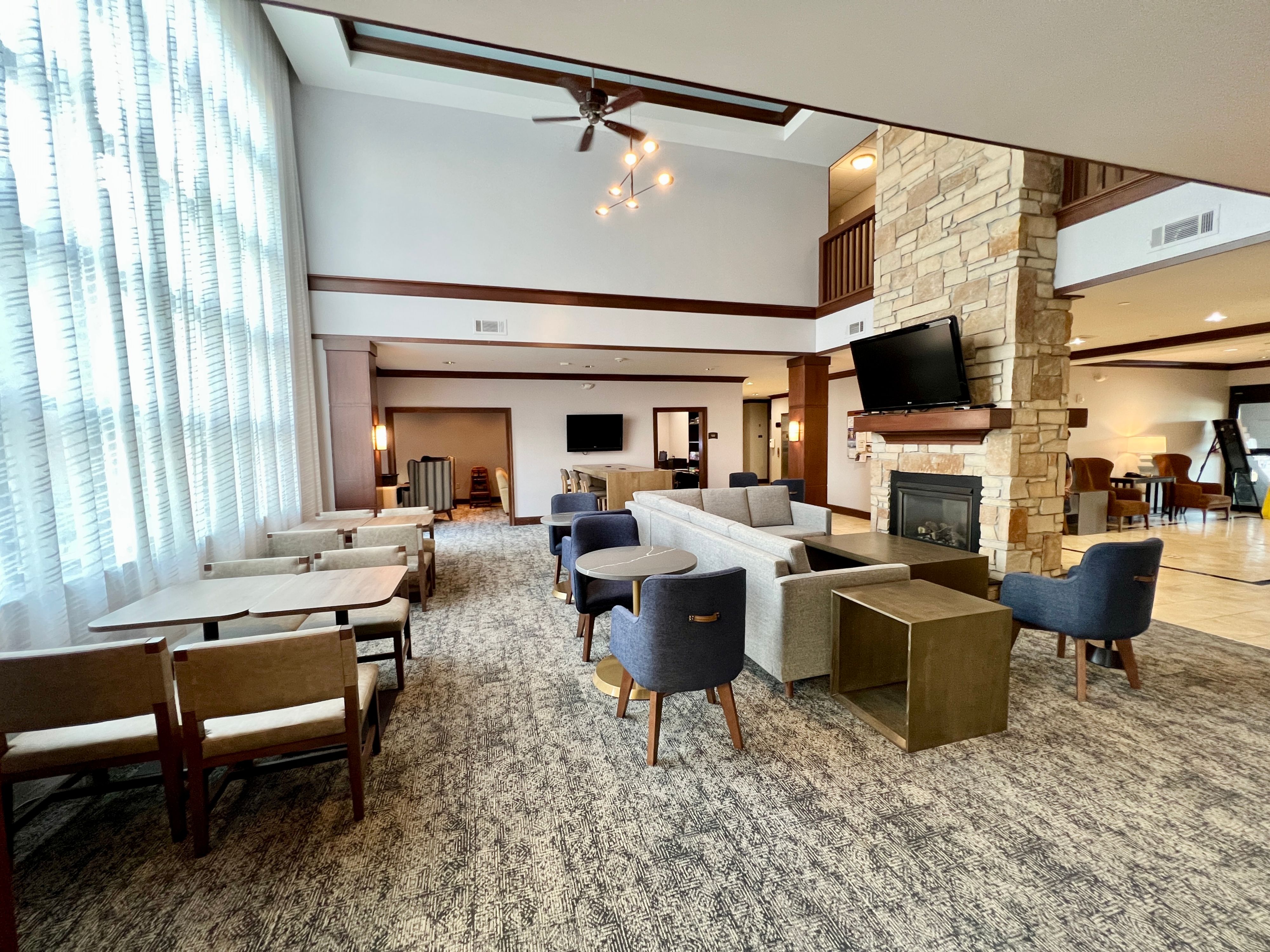 image Bright lobby lounge with cozy seating and high ceilings.