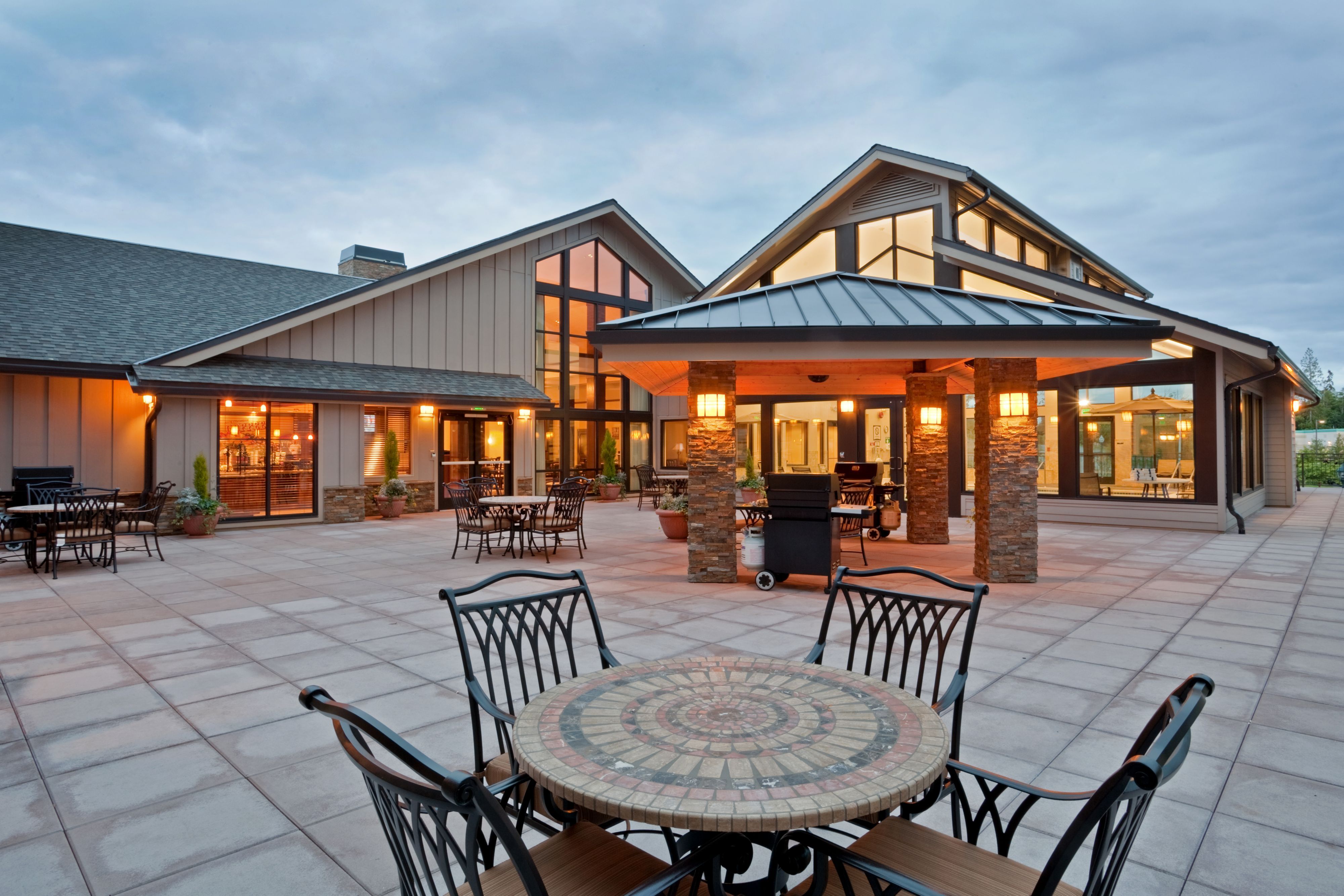 image Settle onto the outdoor patio, furnished with tables and lounge seating