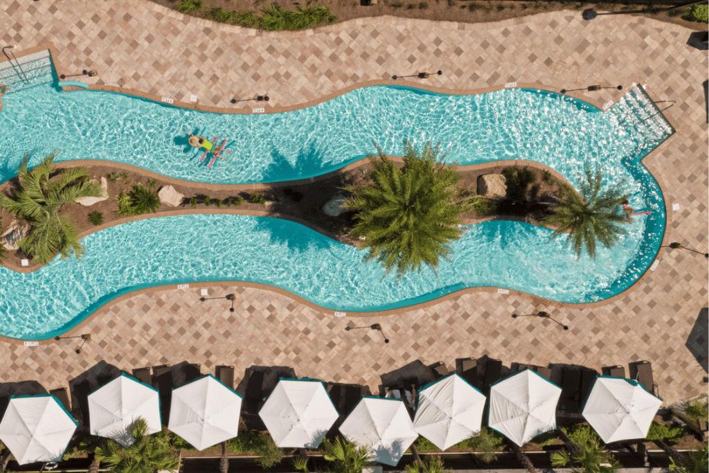 image A bird's-eye view of an inviting pool oasis, framed by the grace of nature.