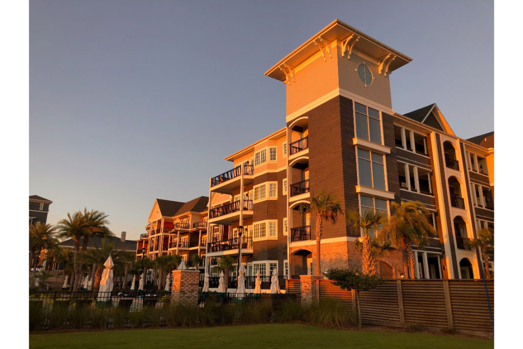 image The resort captured in the warm light of sunset, highlighting its grandeur and serene location.