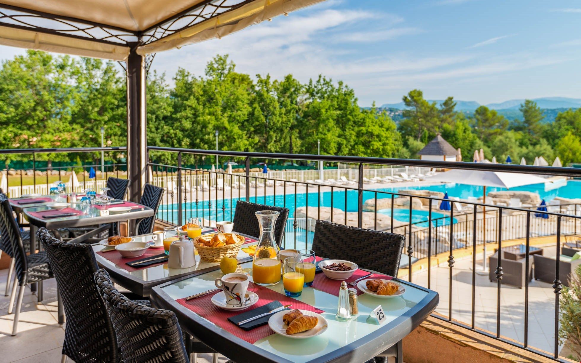 image Enjoy dining outdoors on the patio overlooking the pool.