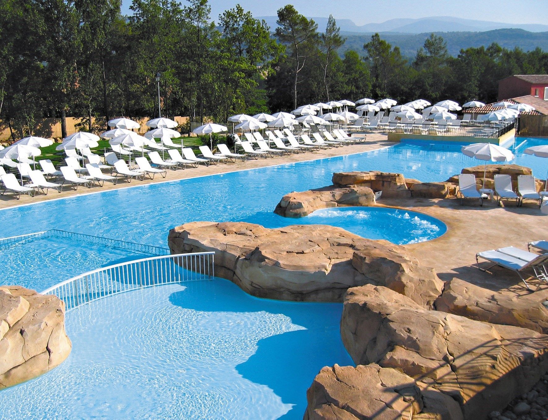 image The large and luxurious outdoor pool is perfect for families.