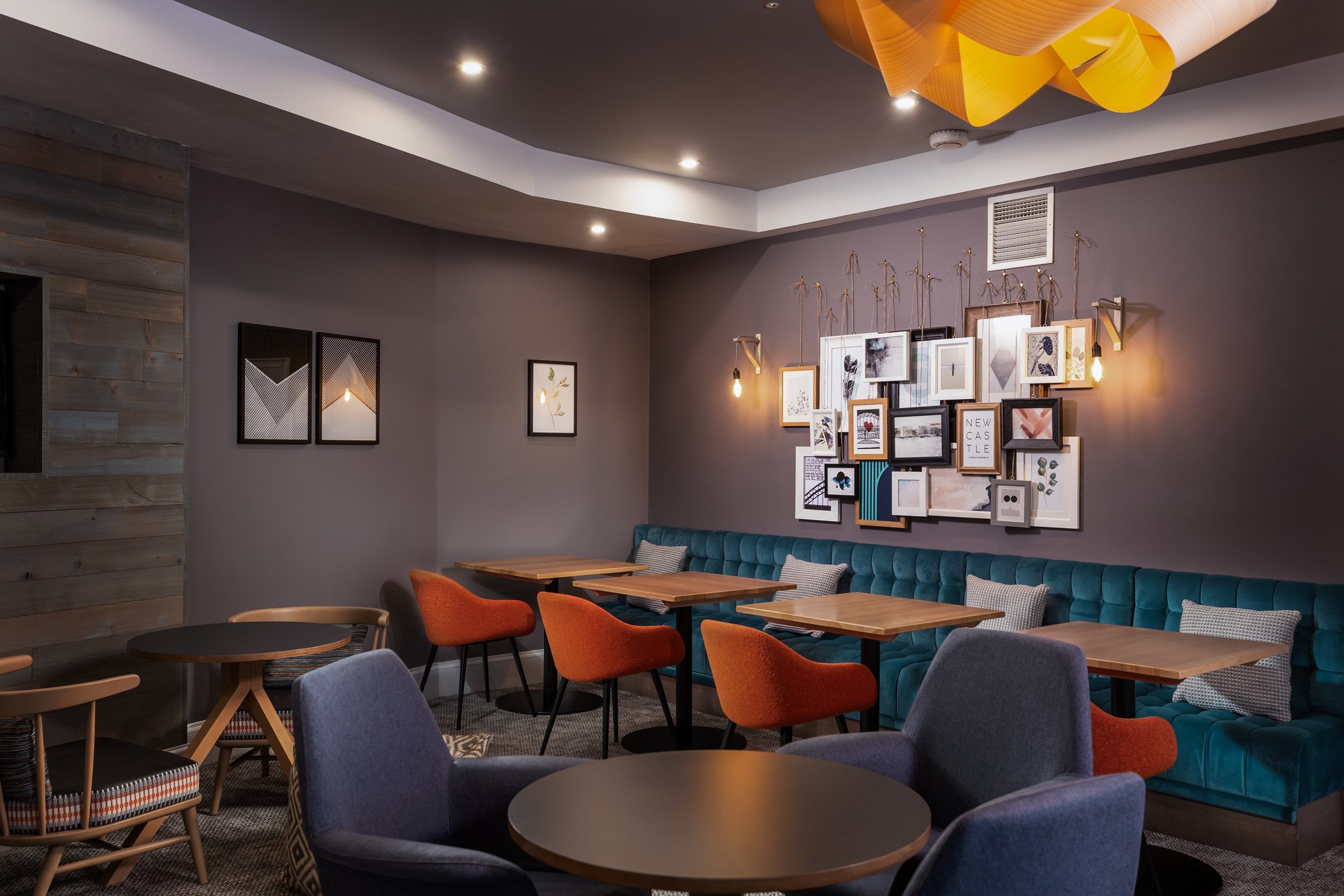 image Communal lounge with cozy seating and decorative wall art.