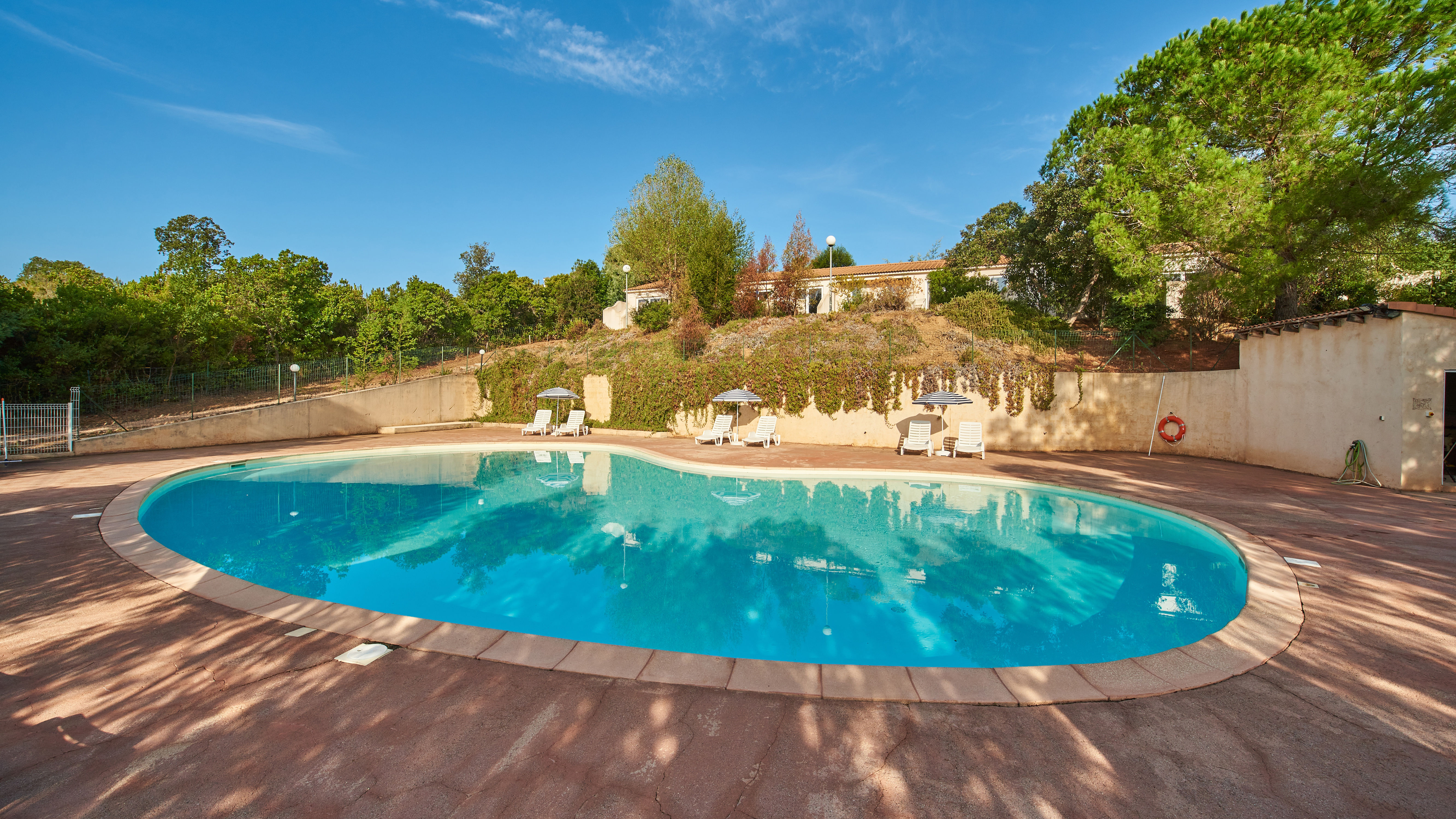 image Embrace the warmth of nature with our sun-kissed pool, where the gentle embrace of the sun's rays naturally heats the water for your comfort.