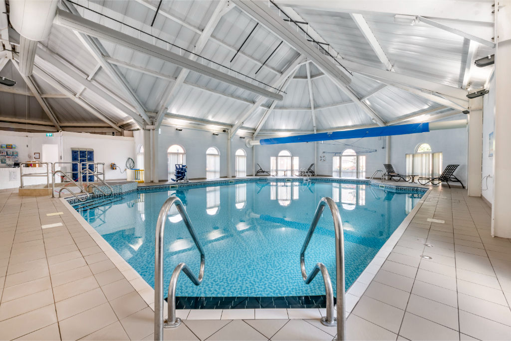 image Another view of the indoor pool, showcasing the expansive space and multiple lanes.