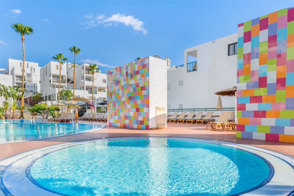 image Poolside serenity meets playful design, creating a unique and engaging environment.