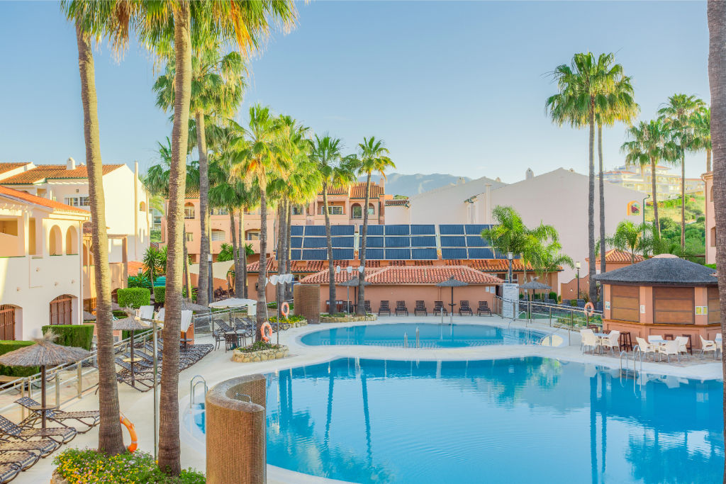 image Inviting outdoor pool with ample lounging space to soak up the sun.