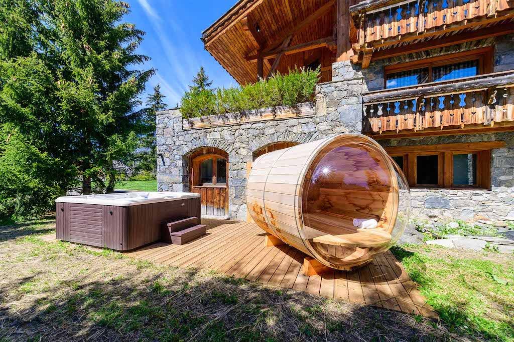 image Soothe your muscles either in your own private outdoor hot tub or sauna.