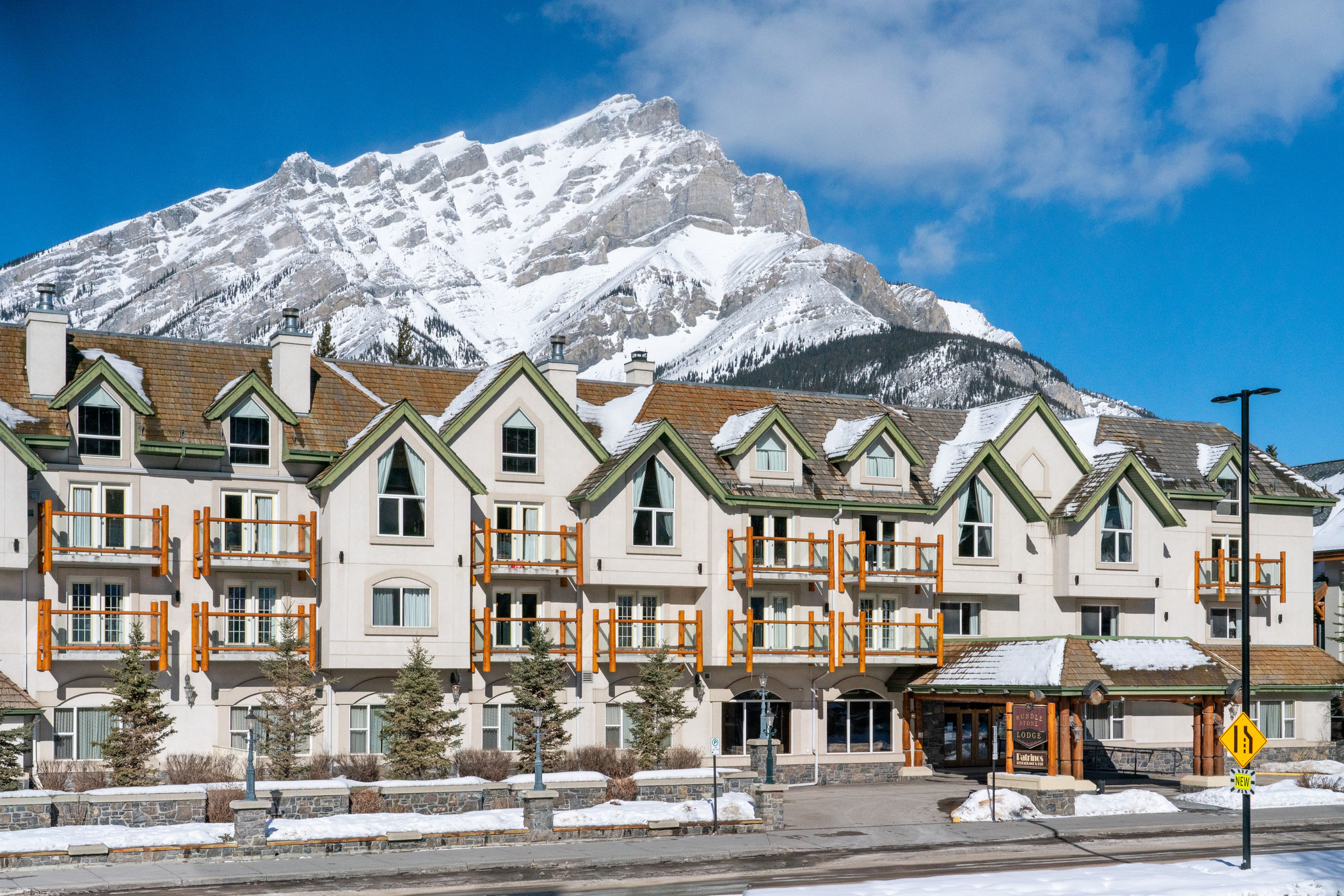 image Snow blankets the rooftops and surrounding peaks on a clear winter day