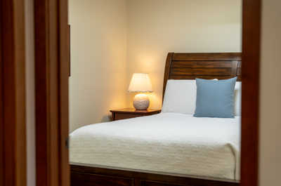 Bedroom with a bed and a bedside lamp