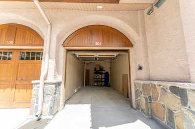 View of garage interior with shelving and items