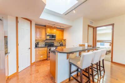 Kitchen with wooden cabinets and stainless-steel appliances