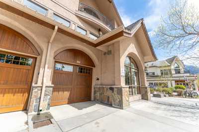 Building exterior featuring arched windows and doors
