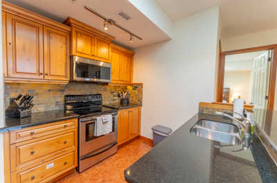 Kitchen with wooden cabinets, stainless appliances, and counter space