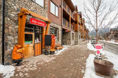 The charming streets of Canmore, where quaint shops and fresh snow create a winter wonderland.