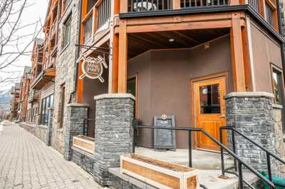 The charming streets of Canmore, where quaint shops and fresh snow create a winter wonderland.