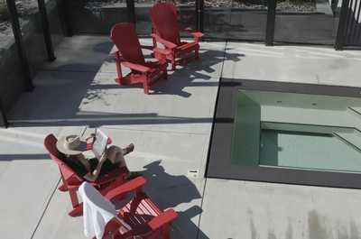Unwind in style with a soothing soak under the summer sky. The hot tub is a shared space.