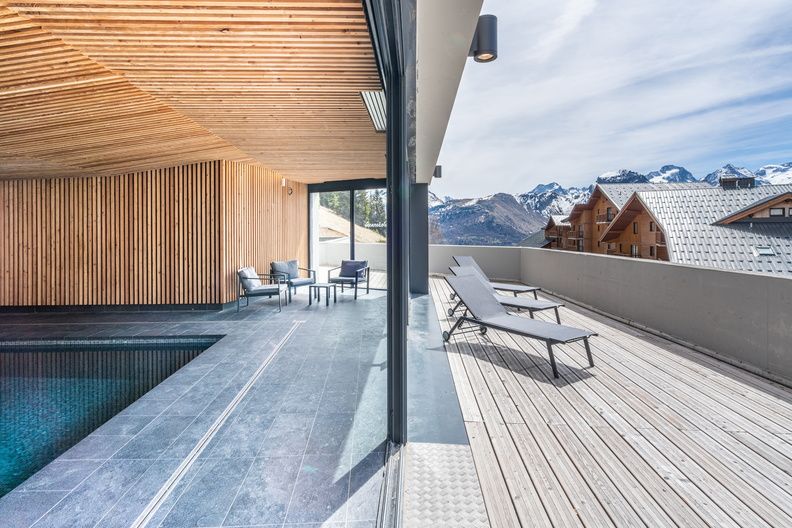 image Lounge in the sun by the indoor pool.