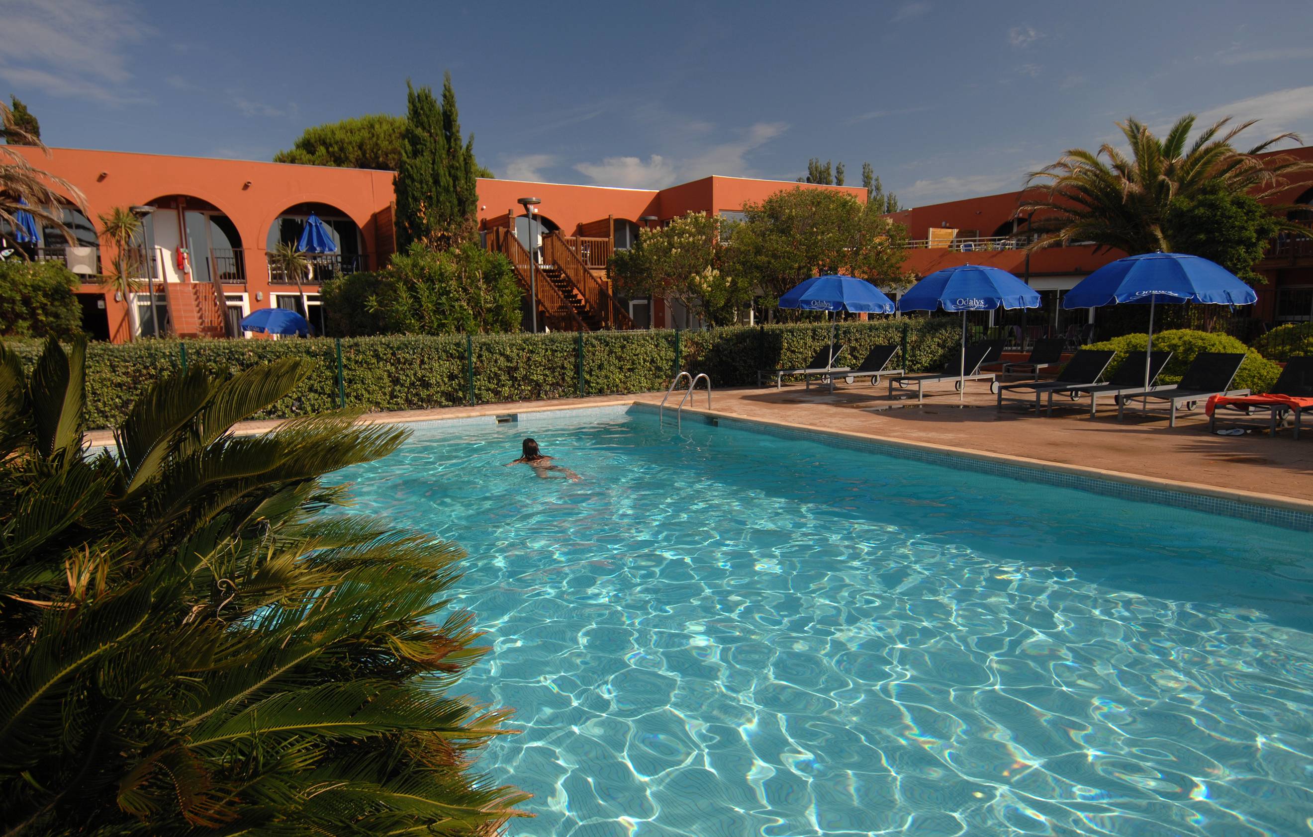 image Dive into the outdoor pool on a hot summer day.