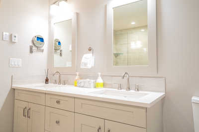 Experience luxury in this elegant bathroom, featuring double sinks and stylish fixtures.